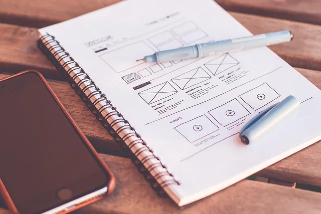 plans, design, web design, designer, desk, document, drawing, iphone, notebook, paper, pen, sketching, design, design, web design, web design, web design, web design, web design, designer. How Welsh Language Standards affect bilingual social selling campaigns